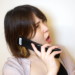電話口でイライラする女性